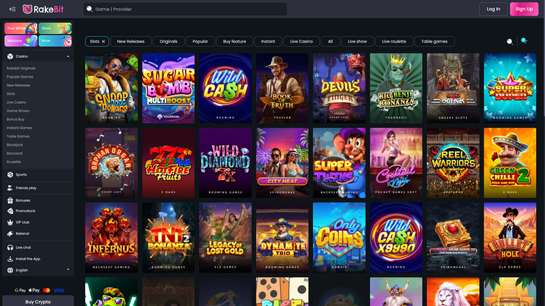 A casino lobby screen on the RakeBit site showing a grid of game tiles with a left sidebar menu and top search bar.
