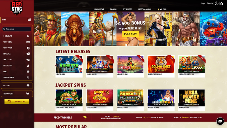 A Red Stag Casino lobby screen showing a promotional hero banner, a Latest Releases row and a Jackpot Spins row of game tiles.