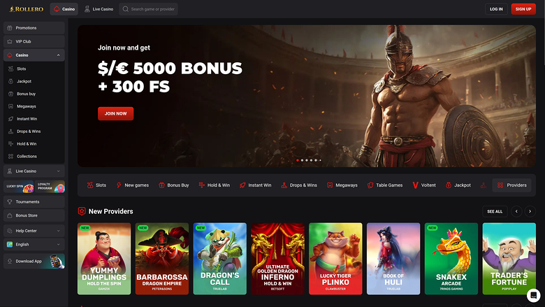 An online casino homepage for Roobet showing a gladiator-themed welcome bonus hero banner and a row of new provider game tiles.