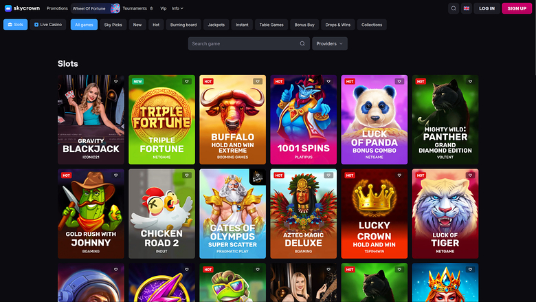 An online casino lobby page showing a Slots section with a grid of game tiles beneath a top navigation bar and search field.