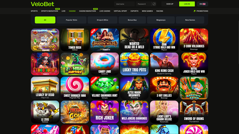 An online casino lobby page for VeloBet showing a grid of game tiles beneath a top navigation bar and category tabs.